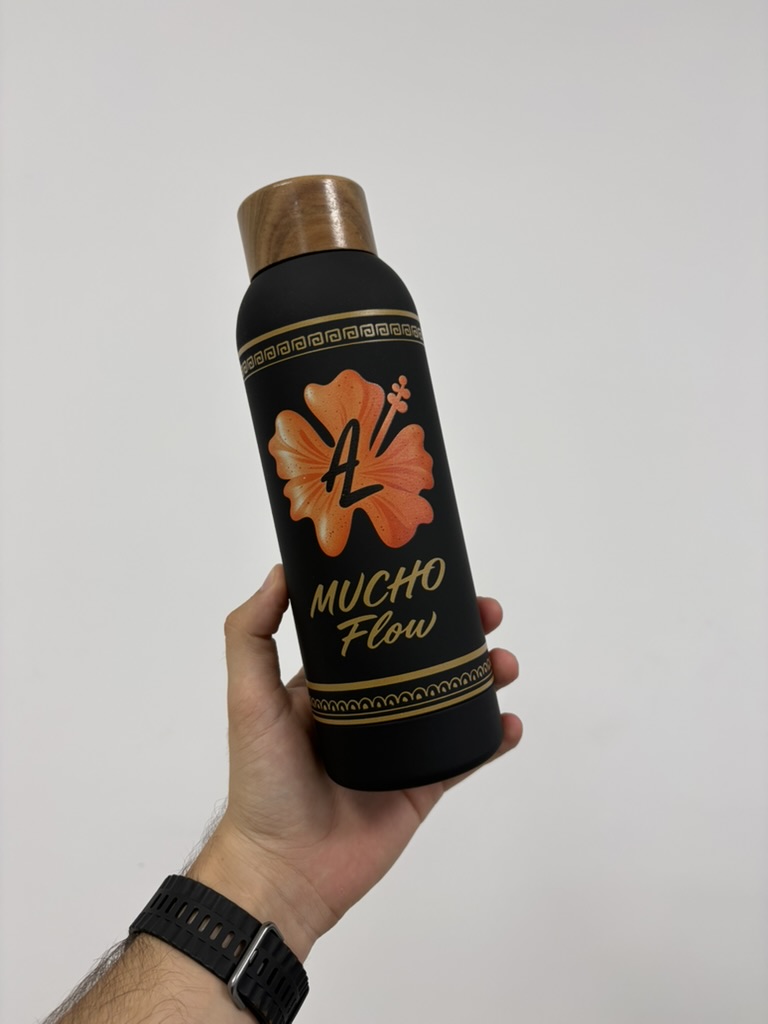 Bidón Cosmix personalizado con flor naranja: trabajo realizado por Grafiglas